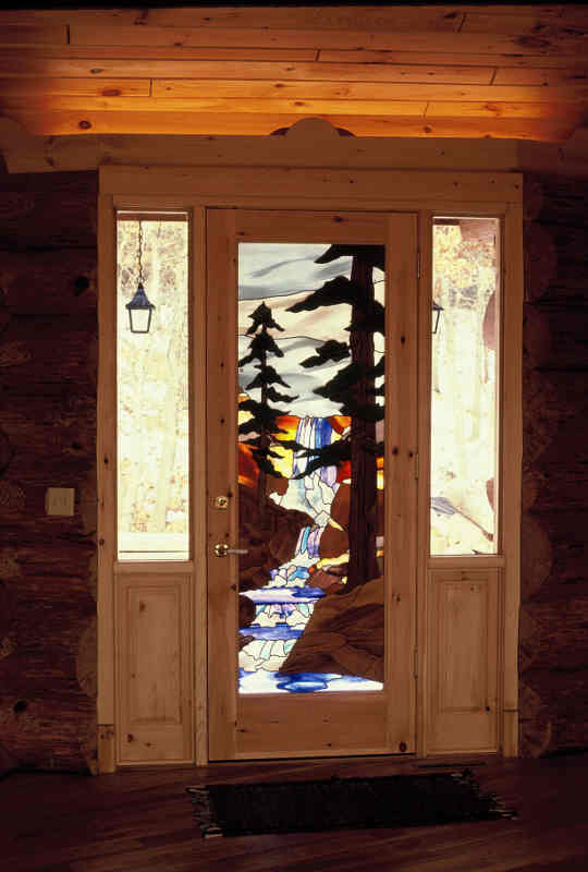 stained glass entry door with sidelites in knotty pine